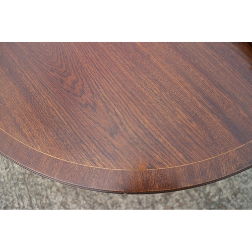 544 - A mahogany and banded double pedestal dining table with one extra leaf, on vase turned columns and t... 