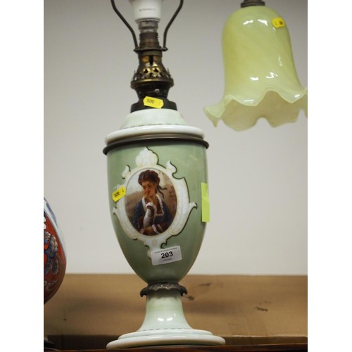 200 - A late 19th century porcelain oil lamp with figure decorated panel, etched shade and chimney, 19