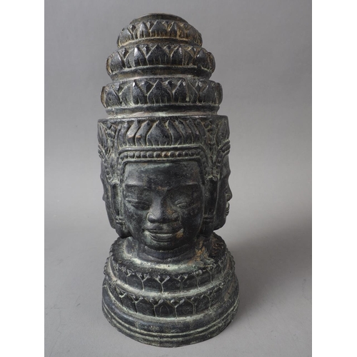 106 - A Khmer patinated four-faced crowned Buddha head, 7 1/2