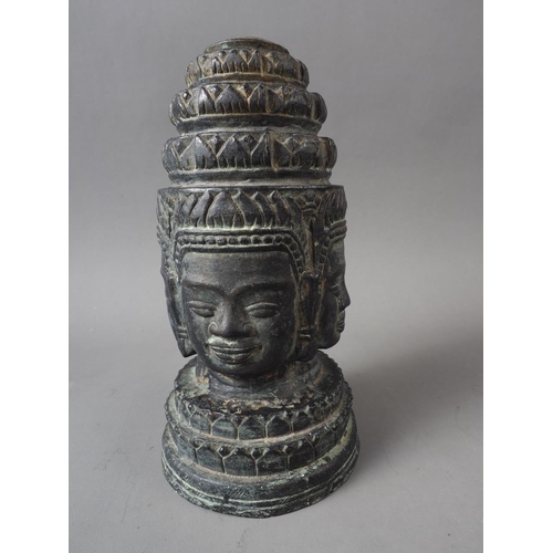 106 - A Khmer patinated four-faced crowned Buddha head, 7 1/2