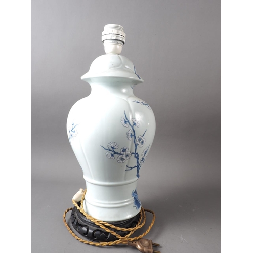 191 - A prunus decorated vase and cover (now converted as a table lamp), 16