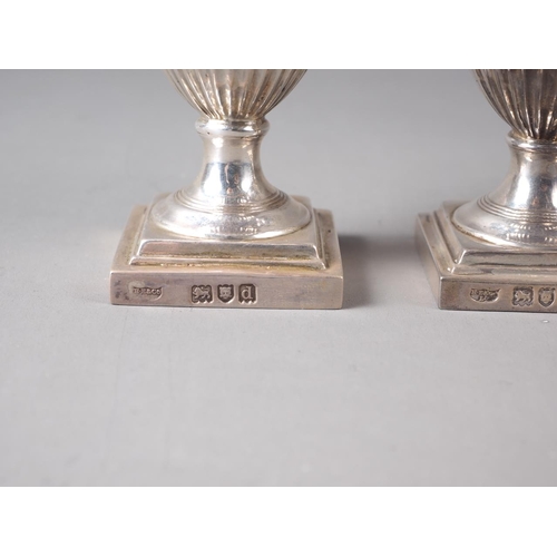 236 - A pair of Adam style silver pedestal pepper shakers, in fitted case, 4.6oz troy approx