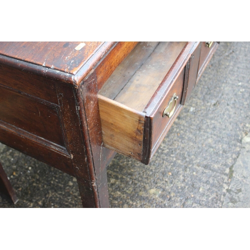 410 - An 18th century fruitwood dresser base, fitted one short and two long fielded panel front drawers, o... 