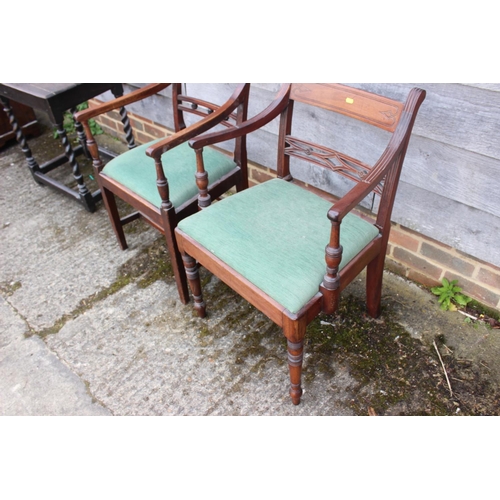 414 - Two 19th century mahogany bar back carver dining chairs with drop-in seats, on turned and stretchere... 