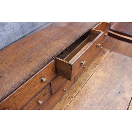 422 - An oak table top nest of eight drawers with brass knob handles, 33 1/4