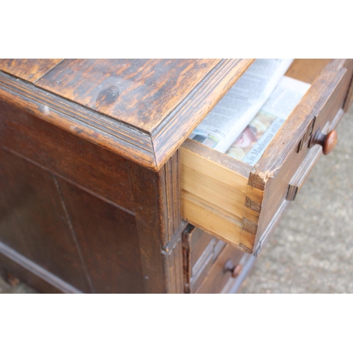 424 - An 18th century oak chest of three drawers with fielded panel fronts and knob handles, 32