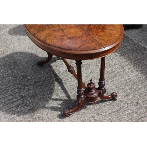 443 - A late 19th century burr walnut oval occasional loo table, on twin turned and stretchered splay supp... 