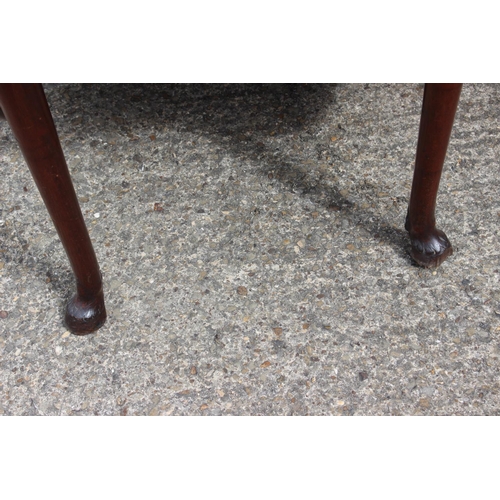 447 - An early Georgian Padouk deep drop leaf dining table, on turned supports with horse hoof feet, 38