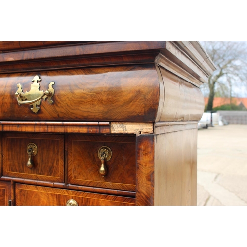 457 - An early 18th century figured walnut and feather banded secretaire abbatant, the upper section fitte... 