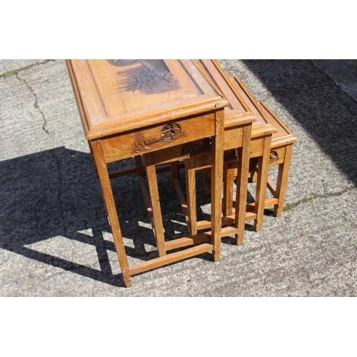 519 - A nest of four Chinese carved hardwood occasional tables, on shaped support, largest 20 1/2