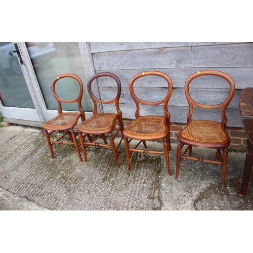 542 - A set of four polished as walnut cane seat bedroom chairs, on turned splay supports