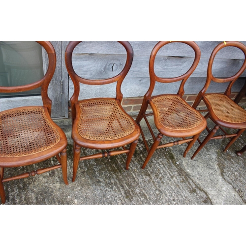 542 - A set of four polished as walnut cane seat bedroom chairs, on turned splay supports