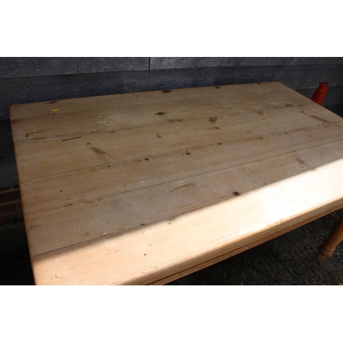 590 - A pine scrub top table, on turned supports, 70