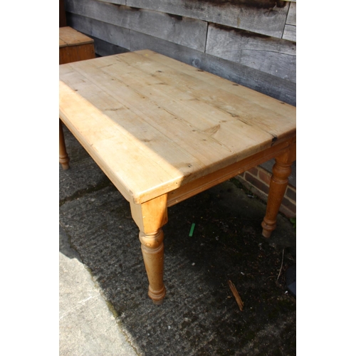 590 - A pine scrub top table, on turned supports, 70