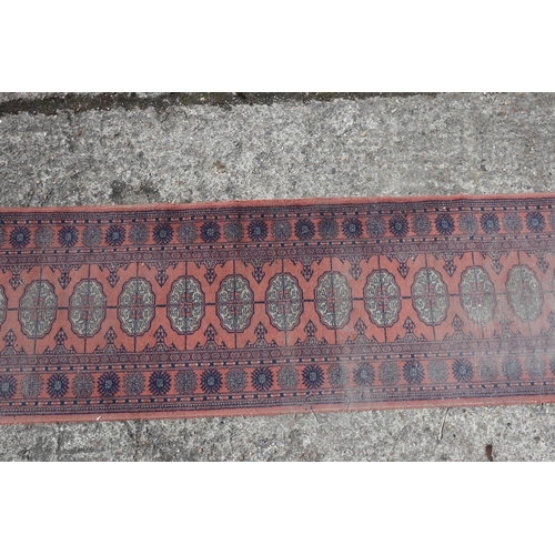 597 - A Kazak style rug with three medallions, 72