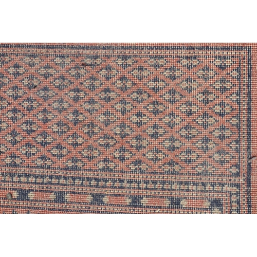 597 - A Kazak style rug with three medallions, 72