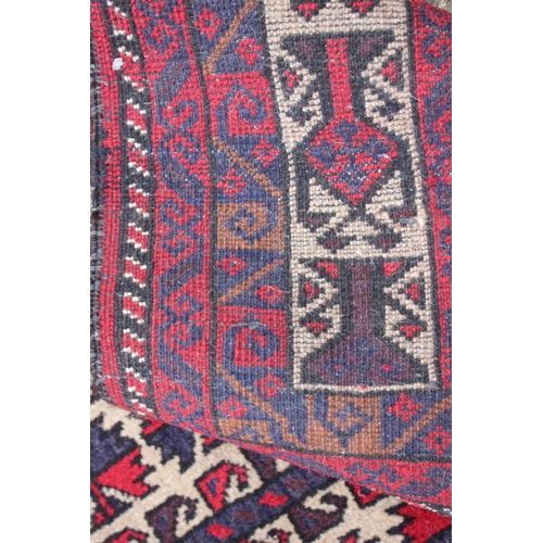 602 - A Bokhara prayer rug of traditional design in shades of red, blue, brown, grey and natural, 32