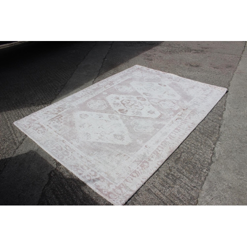 603 - A John Lewis pink Jaipur rug, 35 1/2