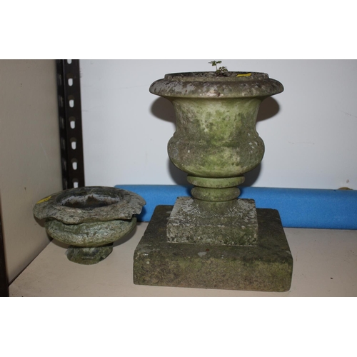 607 - Two turned hardstone garden urns, on square bases, tallest 12