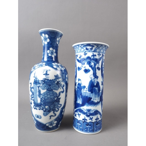 72 - A Chinese blue and white baluster vase with panelled precious object decoration on a floral ground a... 