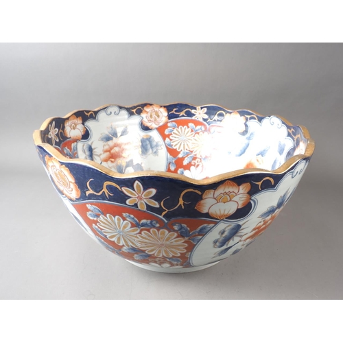 78 - An Imari deep bowl/jardiniere with flower decoration and gilt border, 18