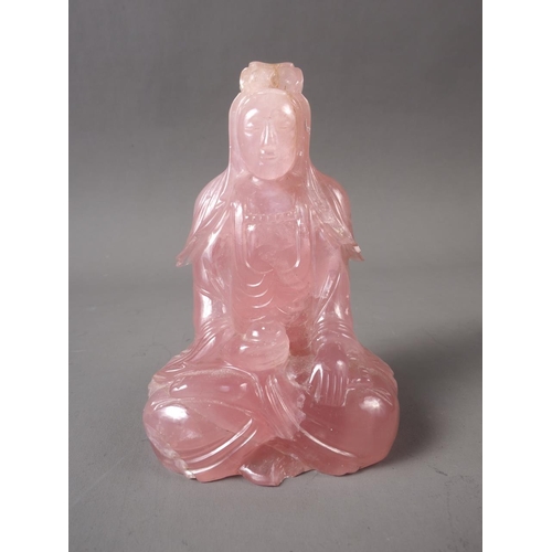 85 - A Chinese rose quartz Buddha, on carved and silver inlaid wooden base, 4 3/4