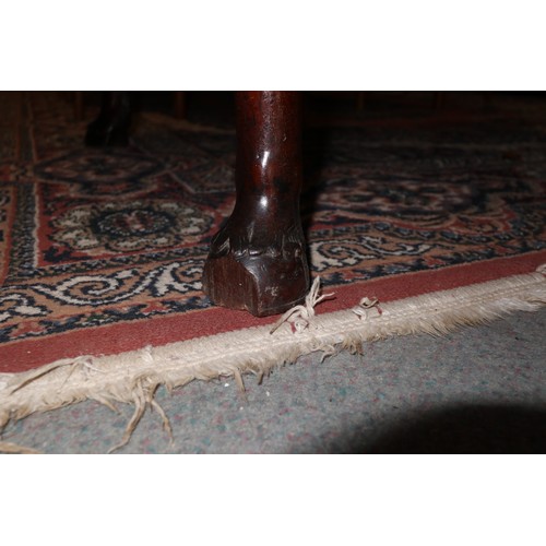 447 - An early Georgian Padouk deep drop leaf dining table, on turned supports with horse hoof feet, 38