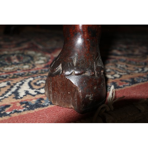 447 - An early Georgian Padouk deep drop leaf dining table, on turned supports with horse hoof feet, 38