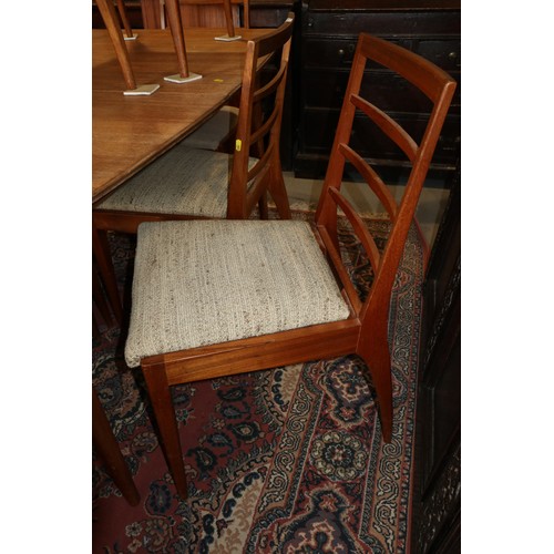 556 - A 1960s McIntosh teak extending dining table, 78