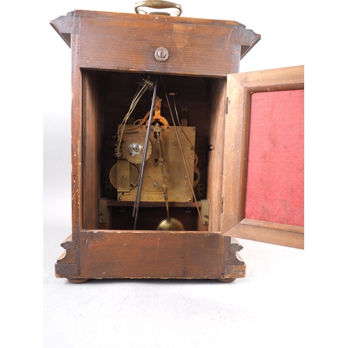 103 - An early 20th century walnut cased bracket clock with silvered dial and eight-day striking and chimi... 