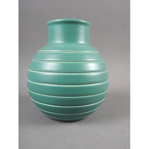 51 - A Keith Murray Wedgwood bulbous green glazed vase with line design, 6 1/4