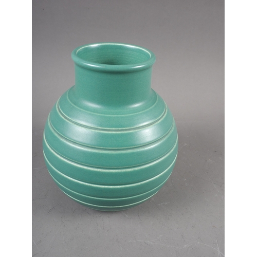 51 - A Keith Murray Wedgwood bulbous green glazed vase with line design, 6 1/4