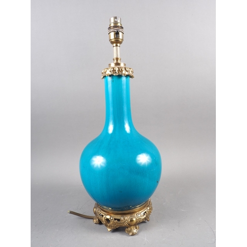 69 - A Chinese turquoise glazed bottle vase with gilt metal mounts (now converted as a table lamp), 17 1/... 