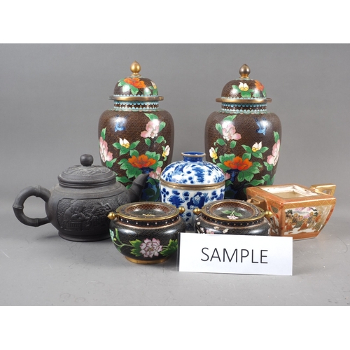 86 - A pair of Chinese cloisonne jars and covers with flower and bird decoration on a brown ground, 10