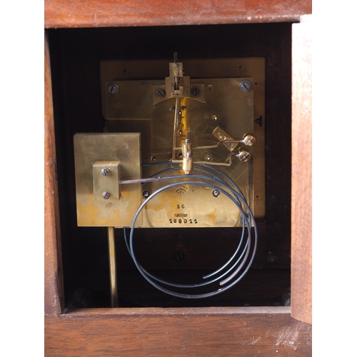 92 - An Edwardian carved walnut cased mantel clock with brass dial and eight-day striking movement 15