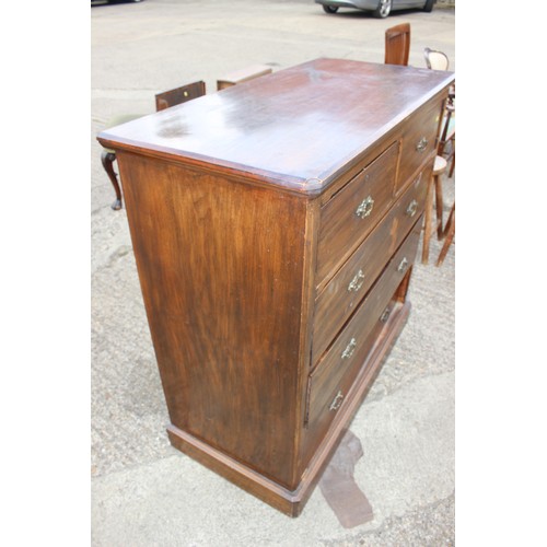 461 - An Edwardian walnut chest of two short and three long drawers with canted corners, on block base, 42... 