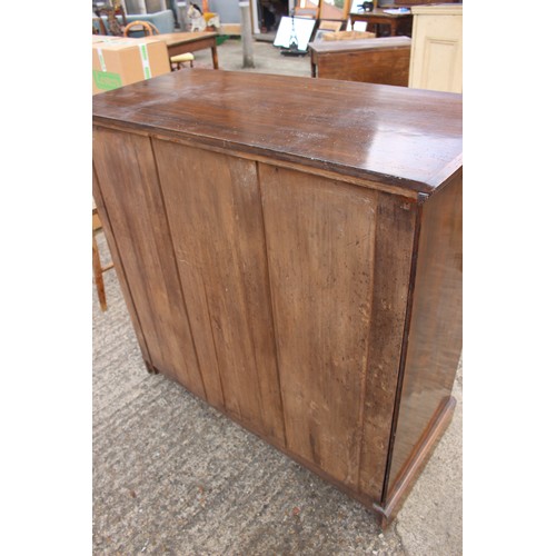 461 - An Edwardian walnut chest of two short and three long drawers with canted corners, on block base, 42... 