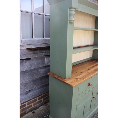 596 - A painted pine dresser, fitted two drawers and two cupboards, 50