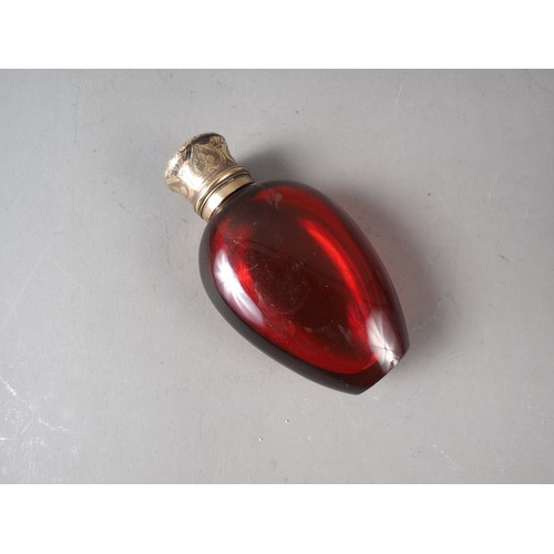 60 - A ruby glass and silver gilt topped scent bottle, 3 1/4