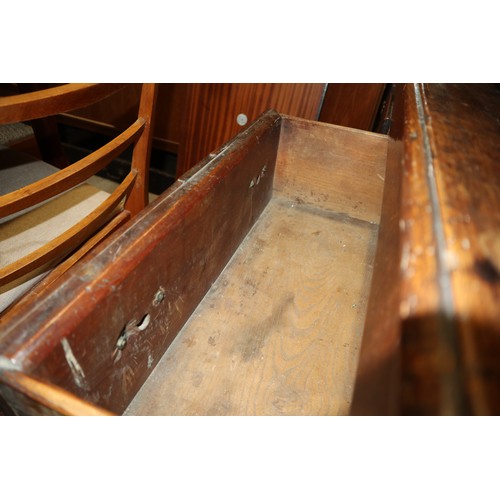 410 - An 18th century fruitwood dresser base, fitted one short and two long fielded panel front drawers, o... 