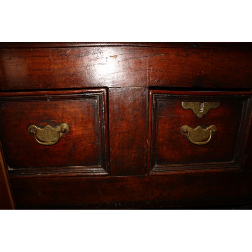 410 - An 18th century fruitwood dresser base, fitted one short and two long fielded panel front drawers, o... 