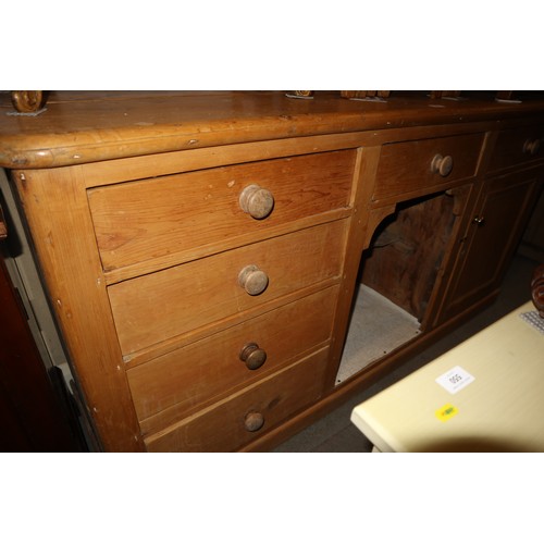 593 - A waxed pine dresser base, fitted three drawers, 