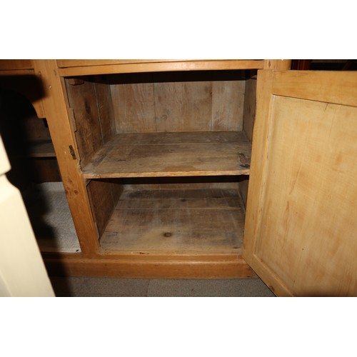 593 - A waxed pine dresser base, fitted three drawers, 