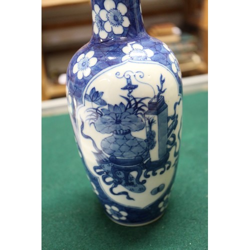 72 - A Chinese blue and white baluster vase with panelled precious object decoration on a floral ground a... 