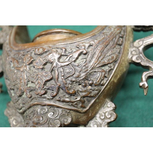 83 - A Chinese bronze censer, decorated clouds, with elephant finial, 10