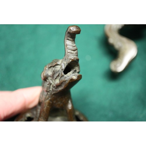 83 - A Chinese bronze censer, decorated clouds, with elephant finial, 10