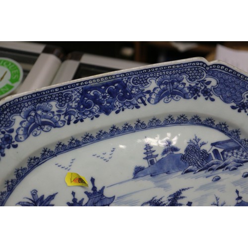 65 - A Chinese export blue and white circular dish drainer with landscape decoration, 13