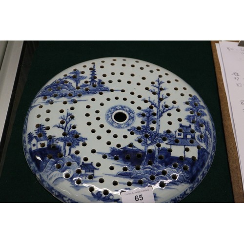 65 - A Chinese export blue and white circular dish drainer with landscape decoration, 13