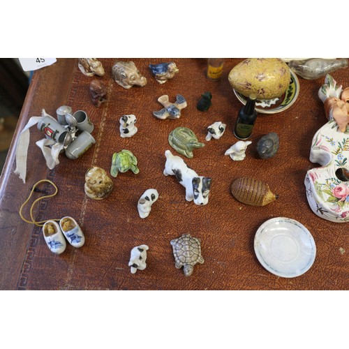 45 - A collection of ceramic and other miniatures, Wade animals, etc