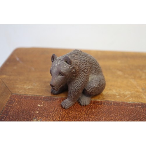 45 - A collection of ceramic and other miniatures, Wade animals, etc